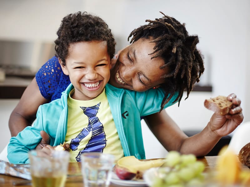 Mother and child eating breakfast