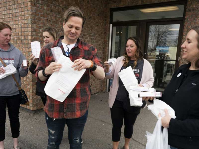 From left to right: Nicole Smith-Holt, Quinn Nystrom, Travis Paulson, Vicky Luedke, Lija Greenseid stand outside a Canadian pharmacy with 3-months supply of insulin (Saturday, May 4, 2019).